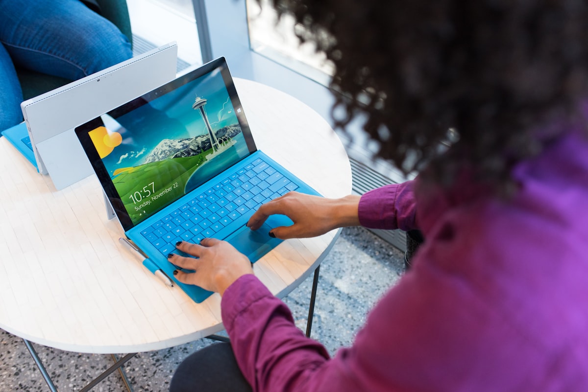 Professional woman working on a laptop in a modern office